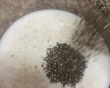 A picture of step 2 of Banana overnight oats topping with blueberry.