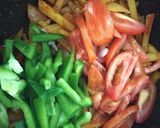A picture of step 4 of Potato Capsicum fry.