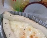 A picture of step 4 of Khachapuri with four cheese.