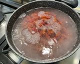 Une image de l'étape 6 de Torsades rouges au lard, petits pois et Boursin®️.