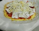 Foto del paso 10 de la receta: Pizza de tortilla con salchicha, jamón, queso y tomate