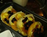 A picture of step 4 of Bread and butter pudding with jam and cranberries.