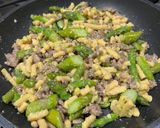 A picture of step 3 of Passatelli with Asparagus and Sausage.