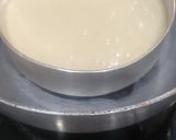 A picture of step 4 of Eggless Whole wheat Vanilla cake with white chocolate ganache.