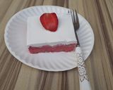 A picture of step 12 of Strawberry milk cake with whipped cream frosting.