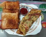 बटर रोस्टेड ब्रेड, अंडा आॅमलेट (anda omelette recipe in marathi) रेसिपी स्टेप 4 फोटो