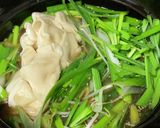 A picture of step 5 of Chinese Hot Pot with Frozen Dumplings and Ramen Soup Base.