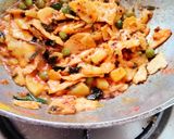 A picture of step 4 of Seyal phulka (leftover rotis in garlic tomato curry).