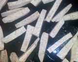A picture of step 4 of Oven roasted crispy arrow root sticks with buttered onions.