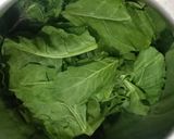 A picture of step 1 of Spinach and potato dry curry.