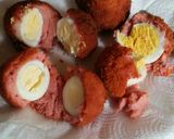 A picture of step 6 of Sausage coated eggs.
