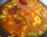 A picture of step 5 of Methi Muthiya Tameta Galka Nu Shaak - Fist-Shaped Fried Methi Dumpling In Sponge Gourd Tomato Curry.