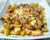 Foto del paso 6 de la receta: Patatas con pota y huevo en tomate