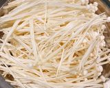 A picture of step 1 of Enoki Mushroom White Broth Healthy Veggie Ramen.