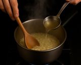 Foto del passaggio 4 della ricetta Risotto Blu con Spirulina e Agrumi