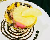 A picture of step 4 of Ice cream with fruits in chocolate bowl.