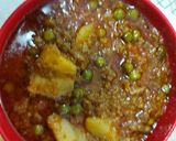A picture of step 3 of Mutton mince with potato green peas.