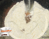 Foto del paso 4 de la receta: Magdalenas de cacao y calabacín
