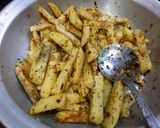 A picture of step 2 of Masala French fries.