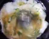 A picture of step 3 of Tortilla Wrap with egg and veggies.