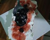 A picture of step 7 of Chocolate chip and raisins white forest block cake.