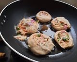 A picture of step 3 of Mini pinwheel pizza bites.