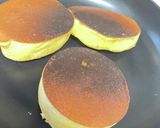 A picture of step 21 of Thick Soufflé Pancakes Made with Meringue.