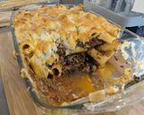 A picture of step 12 of Greek lamb pastitsio bake with rocket salad.