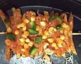 A picture of step 2 of French fries pizza.
