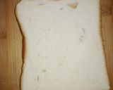 A picture of step 2 of Stuffed cheesy chicken toast.
