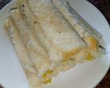 A picture of step 8 of Banana French toast roll ups with peanut sauce. #breakfastideas.
