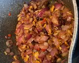A picture of step 2 of Red onion chutney with nuts and raisins.