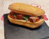 Foto del passaggio 10 della ricetta Panino polpette al sugo, foglie di mentuccia e Parmigiano Reggiano grattugiato
