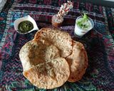 A picture of step 4 of Potato paratha with mint chattny and cucumber raita.