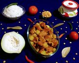 A picture of step 7 of Papaya and Fritters Curry.