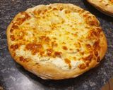 Une image de l'étape 5 de Pizza quatre fromages maison.