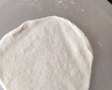 A picture of step 2 of Pita bread with falafel hummus sandwich.