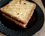 A picture of step 8 of Cheesy Egg Toast Grilled Sandwich.