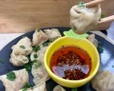 A picture of step 13 of Dumplings served with chilli oil and soya sauce dipping.