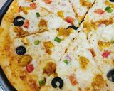 A picture of step 6 of Chicken Tikka Pizza 🍕🍕.