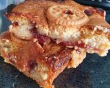 A picture of step 2 of My jammy doggers blondie with strawberry jam filling 👌😍.