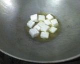 A picture of step 2 of Rosgolla naboratan korma.