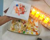 A picture of step 6 of Pineapple delight with m&m bunties.