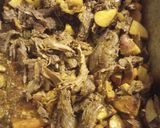 A picture of step 7 of Oven Roasted Goat with Vegetables and Rice.