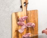 A picture of step 1 of Japanese yakitori (chicken thigh).