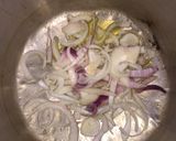 A picture of step 2 of Fish peepered soup garnish with parsely.