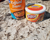 A picture of step 1 of 7 Layer Bean Dip.