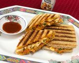 A picture of step 8 of Schezwan Mayo Egg Veg Grilled Sandwich.