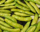 A picture of step 4 of Irresistible Spicy Grilled Edamame.