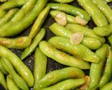 A picture of step 5 of Irresistible Spicy Grilled Edamame.